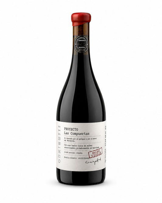 PRIVÉ Wine&Market bottle of Proyecto Las Compuertas Malbec 5 Suelos, a red wine with a red wax seal and a white label detailing its origin and blend.
